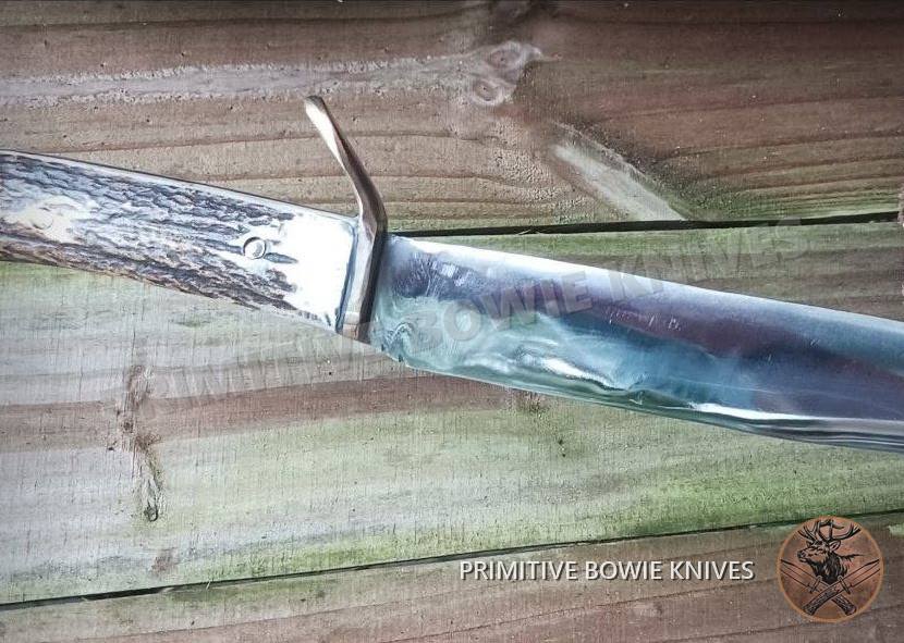Long bowie with curved guard, a handmade knife with an elk stag handle